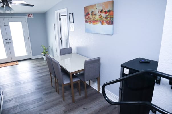 Interior view of a dining area with a table and chairs