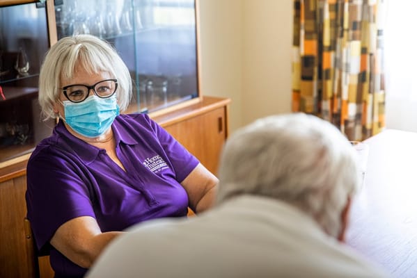 Staff member interacting with a resident in a common area