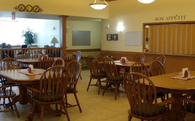 Dining area with wooden tables and chairs