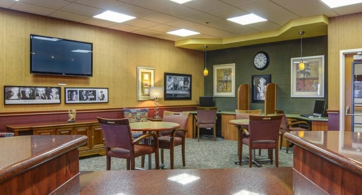 Common area with seating and artwork on the walls