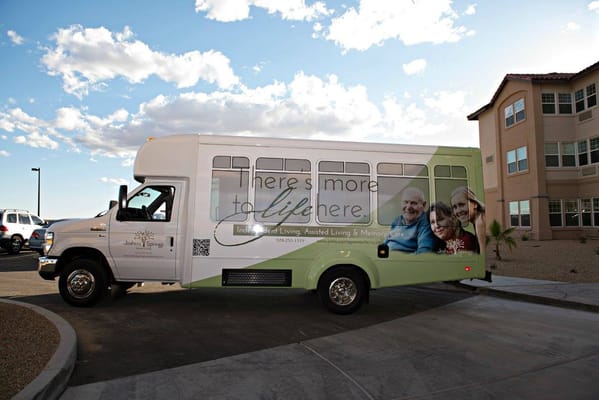 Bus with Joshua Springs branding parked outside the facility