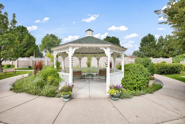 A picturesque gazebo in a landscaped garden