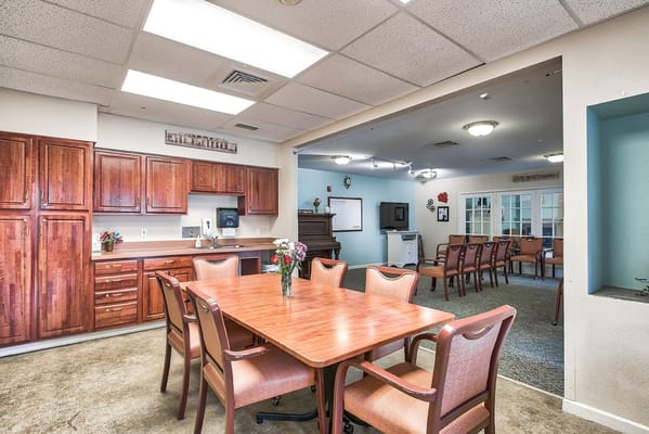 Common area with dining table and kitchenette