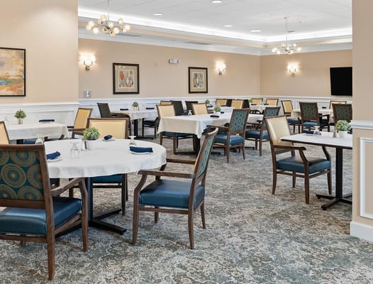 Dining room setup with tables and chairs