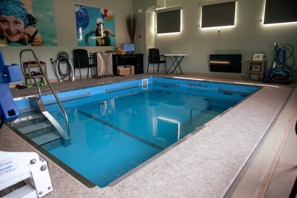 Indoor hydrotherapy pool with steps and training equipment