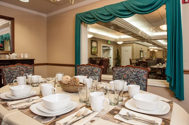 Dining table set with dishes in the dining area