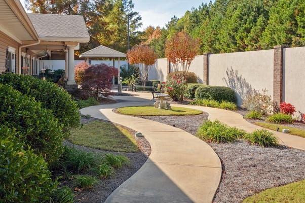 Pathway through a landscaped outdoor garden area.