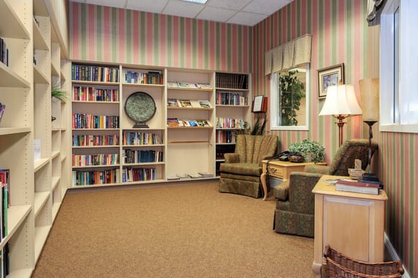 Cozy library area with books and comfortable seating