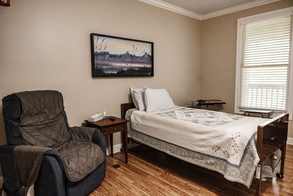 Cozy resident room with a bed and seating area