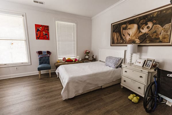 A well-decorated resident room with art and personal items
