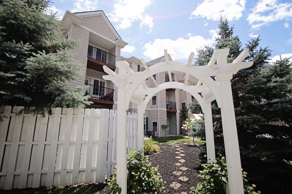 Outdoor archway leading to the facility grounds