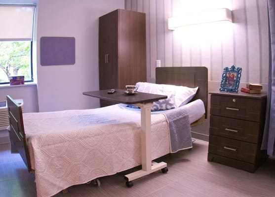 Private resident room with a bed and furnishings