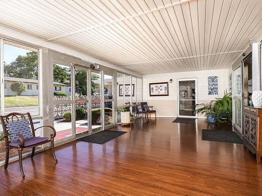 Bright lobby area with seating and plants