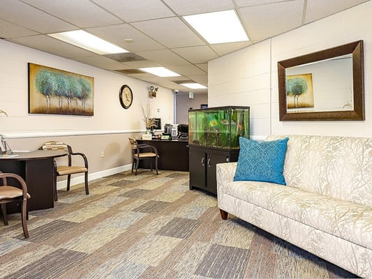 Interior common area with seating and an aquarium