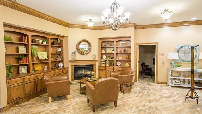 Cozy common area with seating and bookshelves
