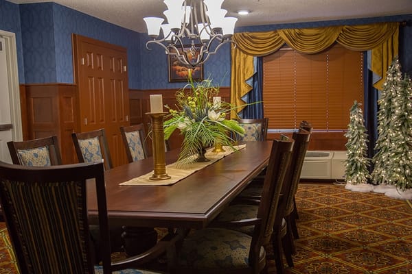 Dining area with long table and decorative elements