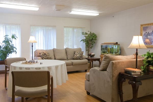Cozy common area with seating and a fish tank