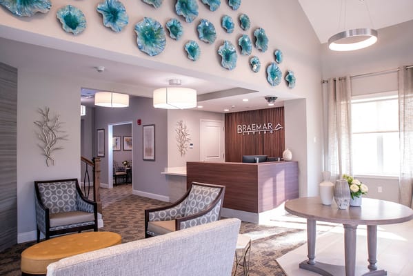 Bright interior lobby with seating area and reception desk