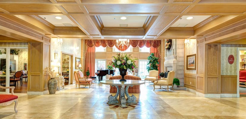 Bright and welcoming lobby with seating and floral arrangements
