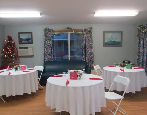 Decorated dining area with tables set for an event