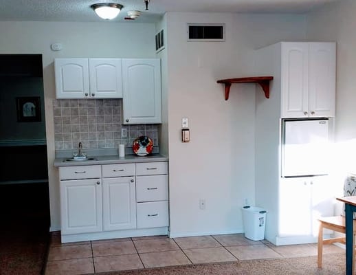 Interior kitchen area of a senior living unit