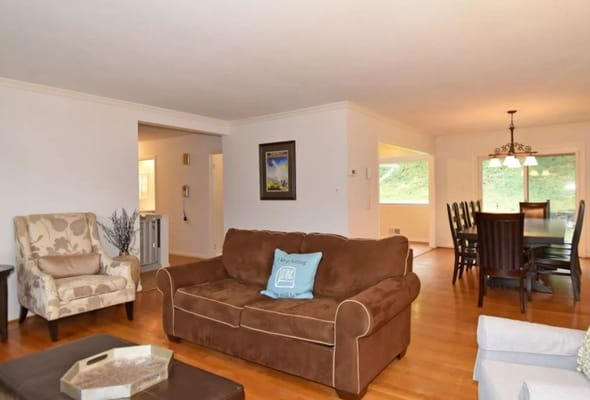 Bright shared living space with furniture and dining area