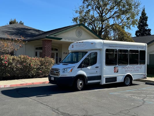 Facility transport van parked outside the building