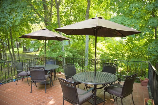 Outdoor patio area with tables and umbrellas