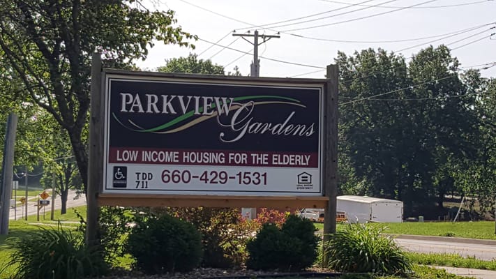 Sign indicating Parkview Gardens Apartments offering low income housing for the elderly.