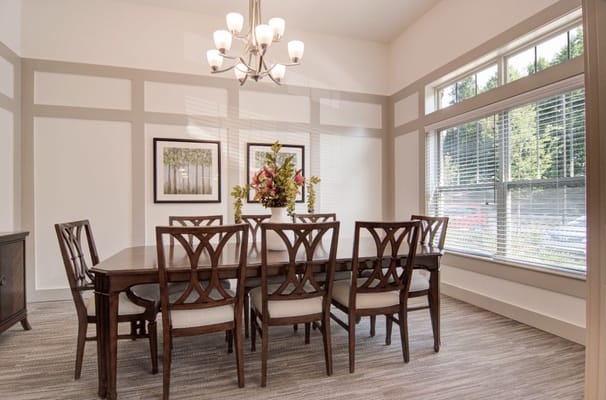 Bright dining area with wooden table and chairs