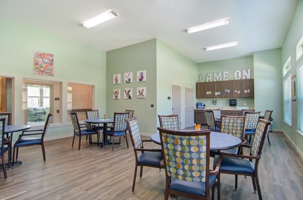 Interior common area with tables and chairs for activities
