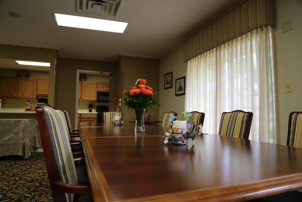Interior common area with a dining table and flowers