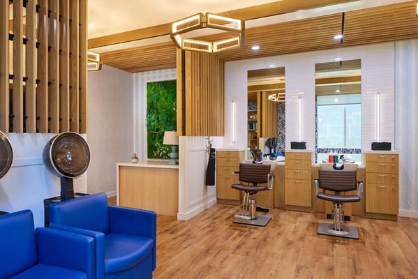 Interior view of the salon with styling stations and seating.
