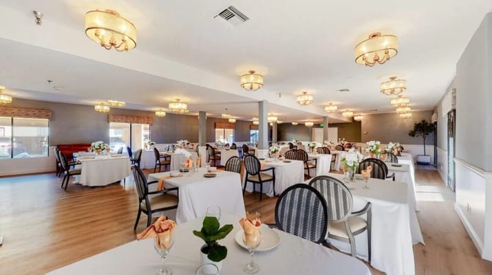 Bright dining room with elegantly set tables