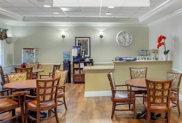 Dining area with tables and chairs in a well-lit space