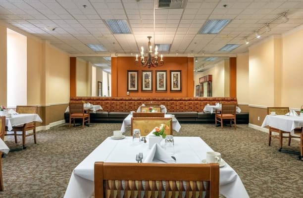 Elegant dining room setup with tables and chairs