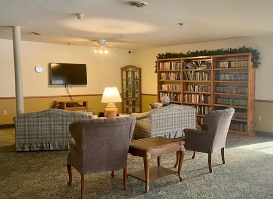 Common area with seating and bookshelves