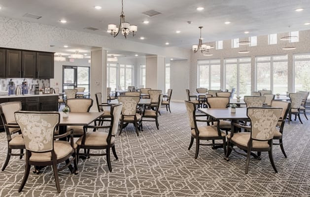 Bright dining room with elegant furniture and windows