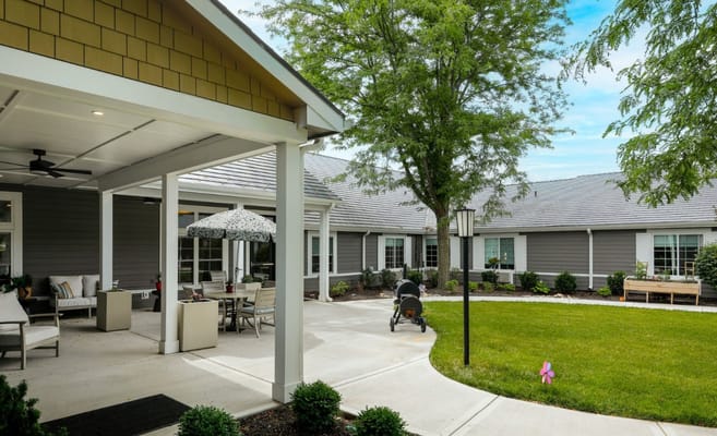 Residents enjoying the outdoor space with patio seating