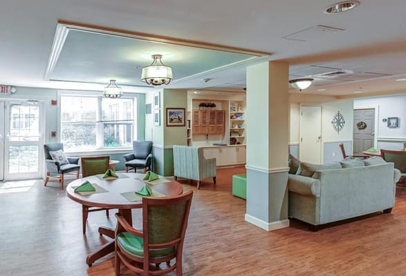 Spacious common area with seating and dining table