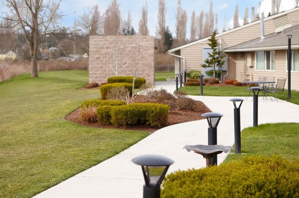Well-maintained walking path in a landscaped area