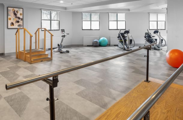 Interior view of the gym with exercise equipment and balance training stairs