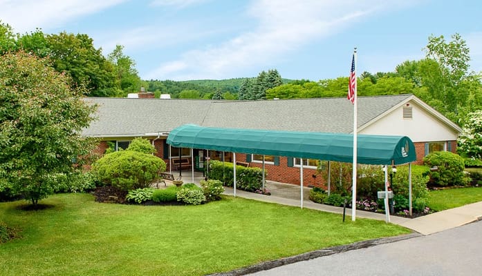 Exterior view of the facility with a covered entrance