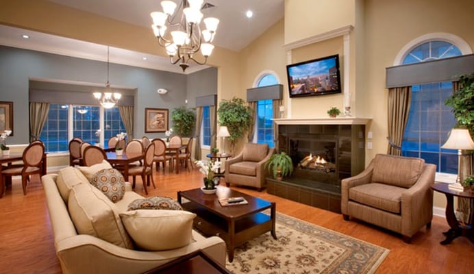 Cozy living room with seating, fireplace, and dining area in Dublin Terrace