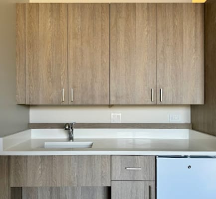Interior view of kitchen cabinets in a resident unit