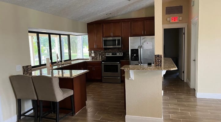Modern kitchen with granite countertops and stainless steel appliances
