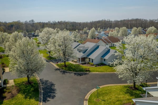 Aerial view of Shepherd of the Valley with blooming trees and houses.