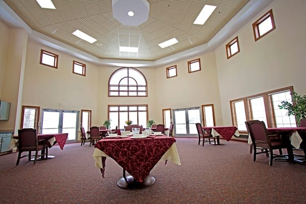 Indoor dining area with tables and chairs at Sprenger Health Care Rose Lane