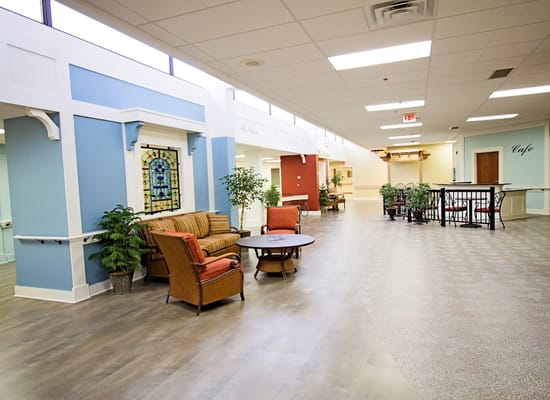 Spacious lobby area with seating and plants