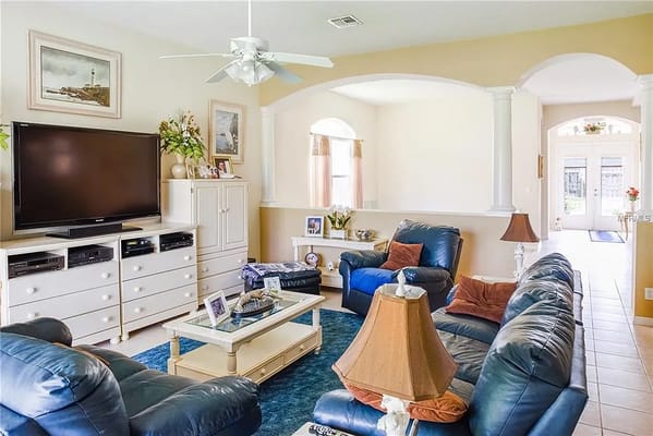 Comfortable living room with blue sofas and a TV